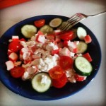 light salad - cucumbers, cherry tomatoes, cottage cheese with crab sticks